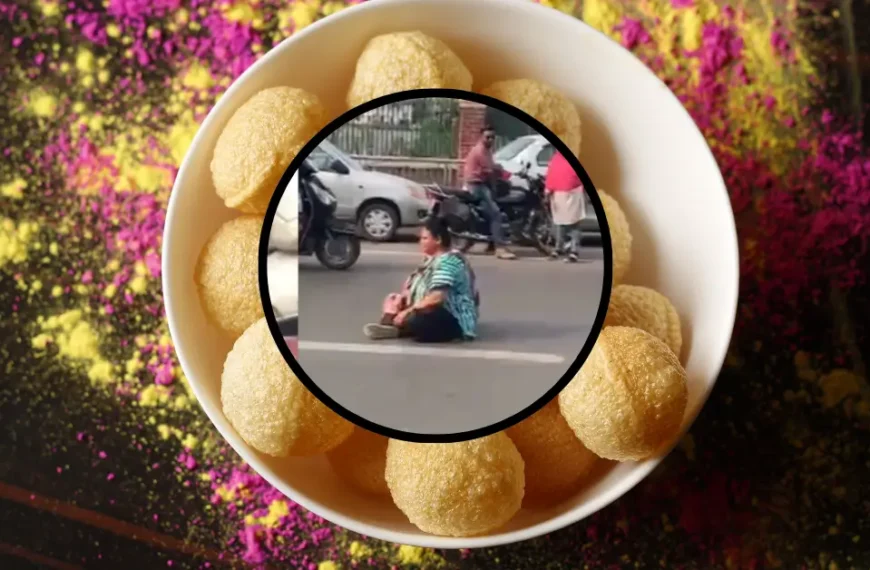 woman sits in the middle of the traffic in vadodara for Panipuri