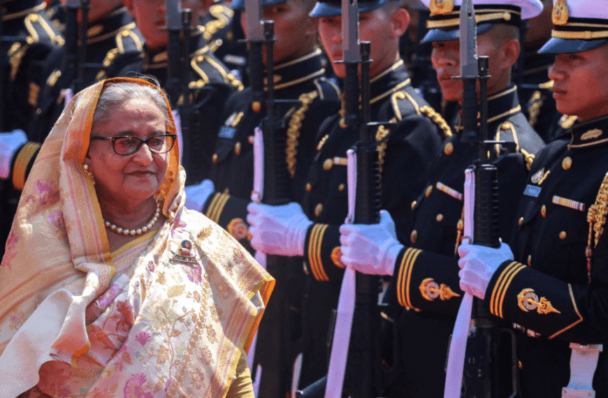 Sheikh Hasina in traditional attire with soldiers