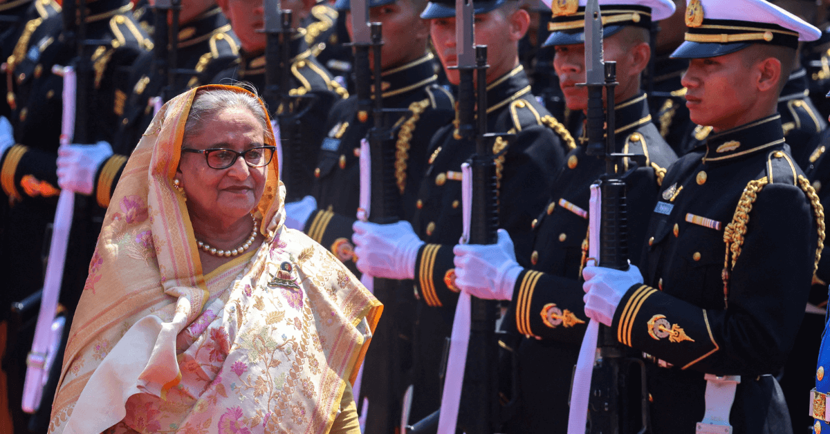Sheikh Hasina in traditional attire with soldiers